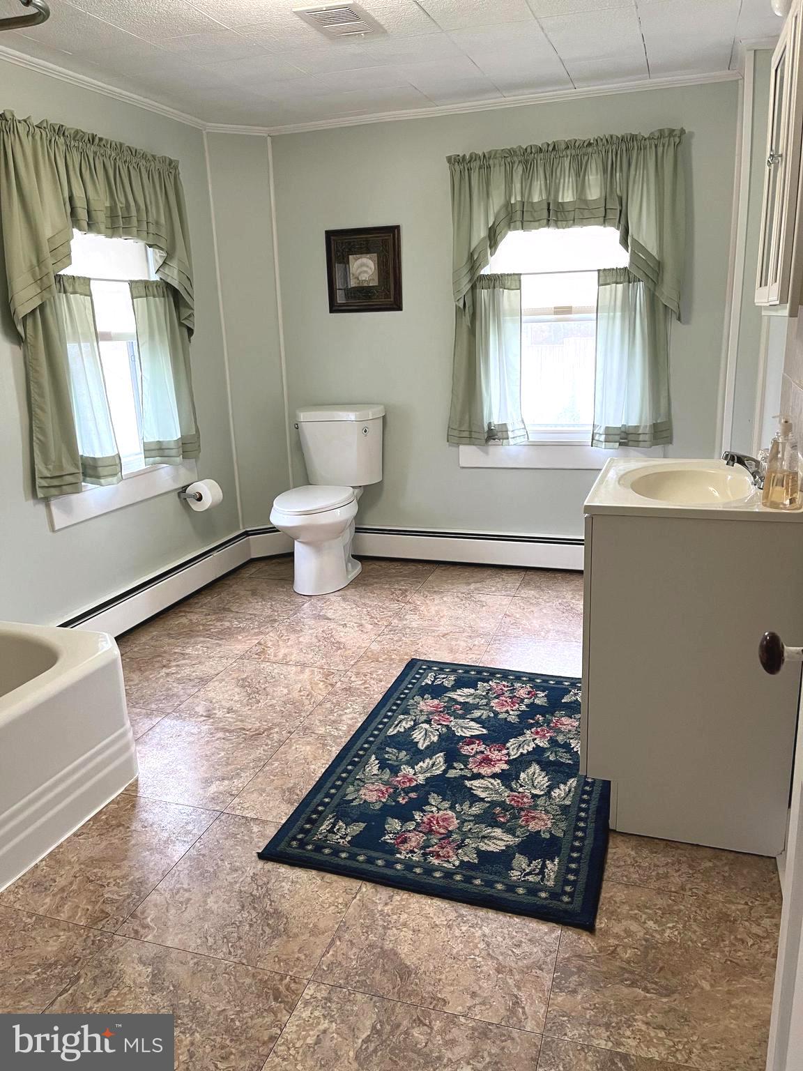 4930 Ridge Road Rosedale, MD 21237 - Photo 23 of 49 a living room with a rug and a window