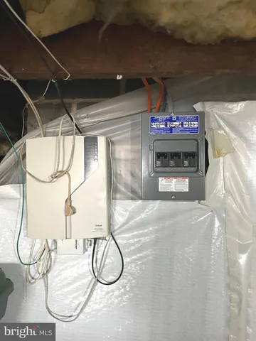 a front view of a house with a basket ball court and a chandelier