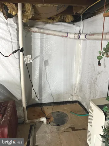 a picture of a bathroom with a shower and a sink