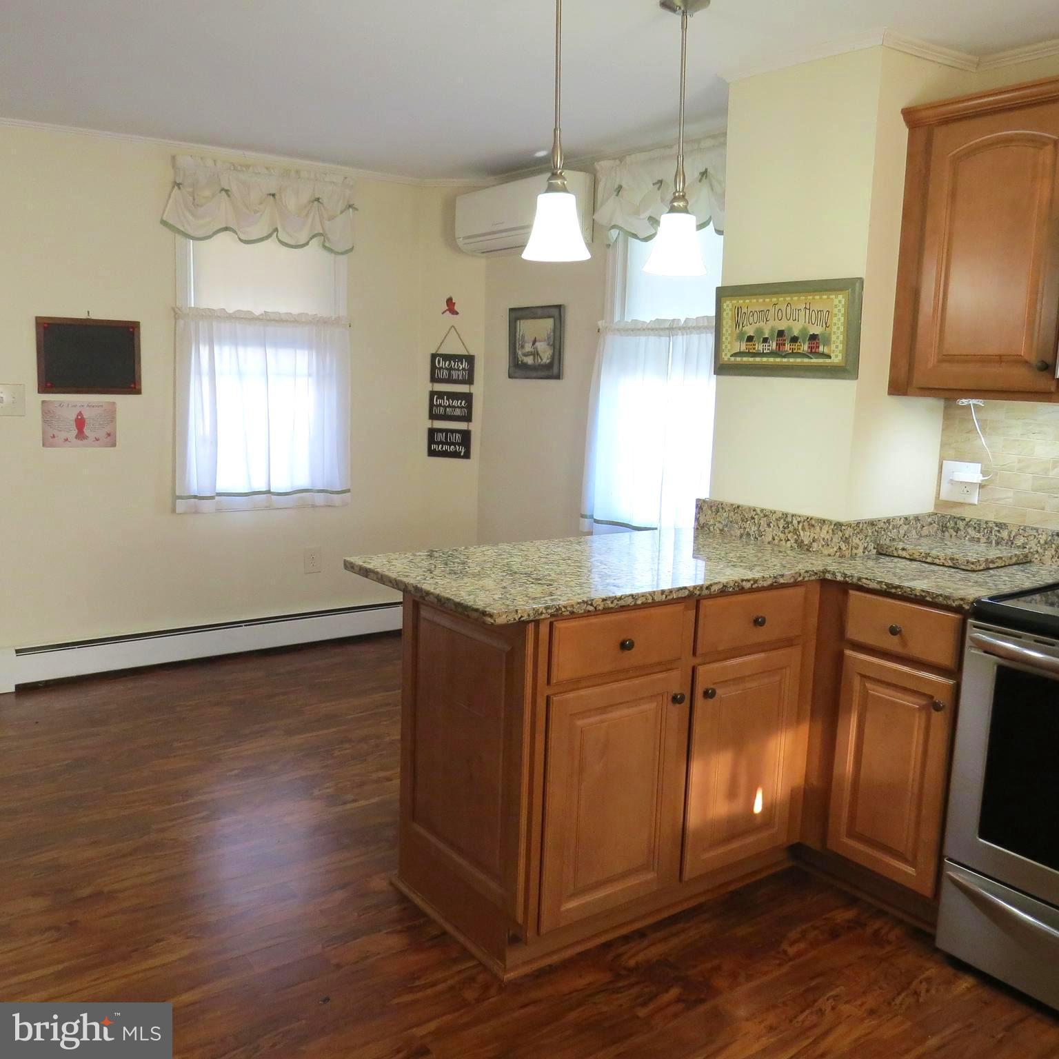 4930 Ridge Road Rosedale, MD 21237 - Photo 10 of 49 a kitchen with granite countertop wooden cabinets a sink and dishwasher