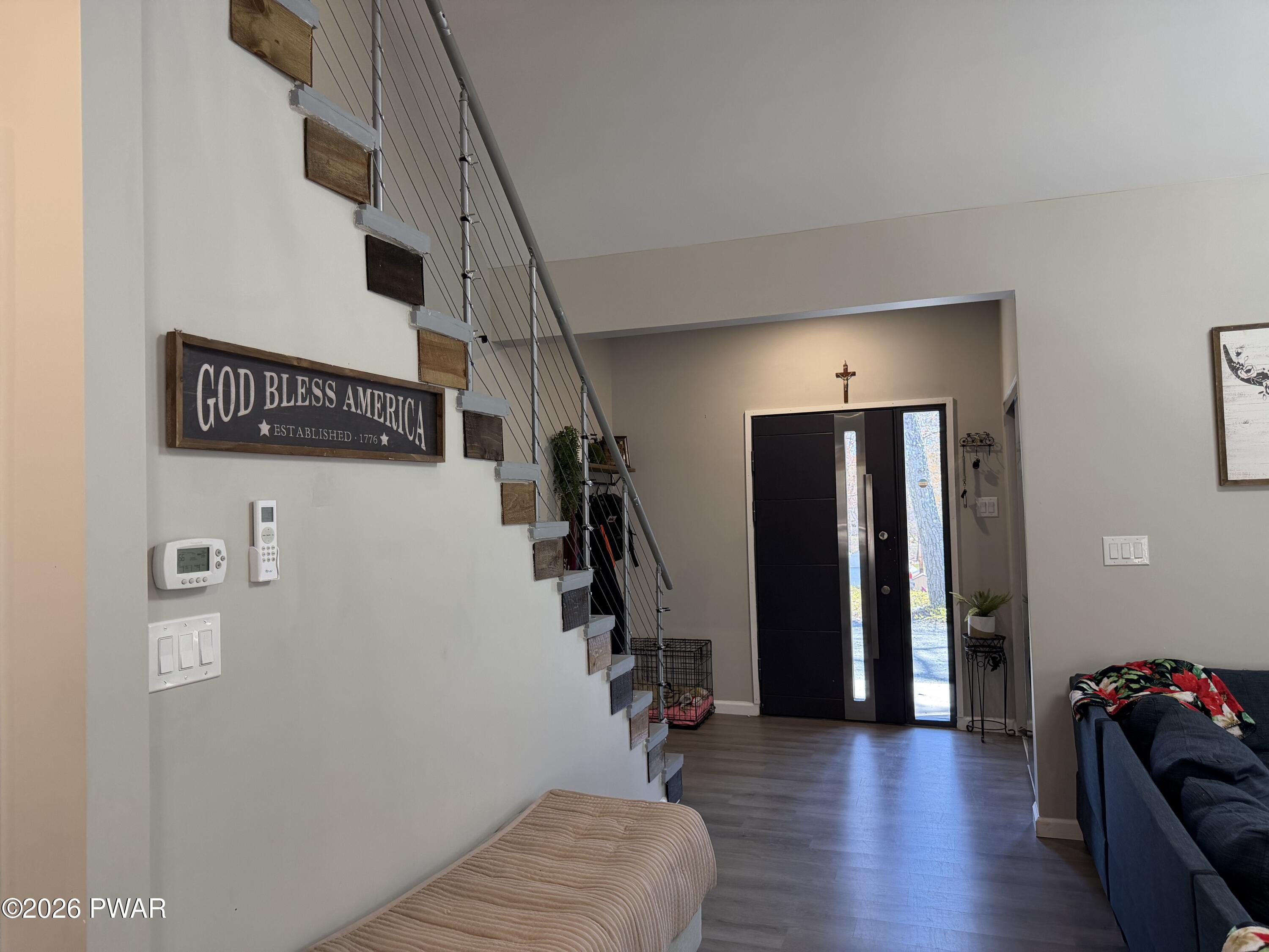 801 Maple Ridge Court Hawley, PA 18428 - Photo 35 of 55 a view of hallway with stairs and wooden floor