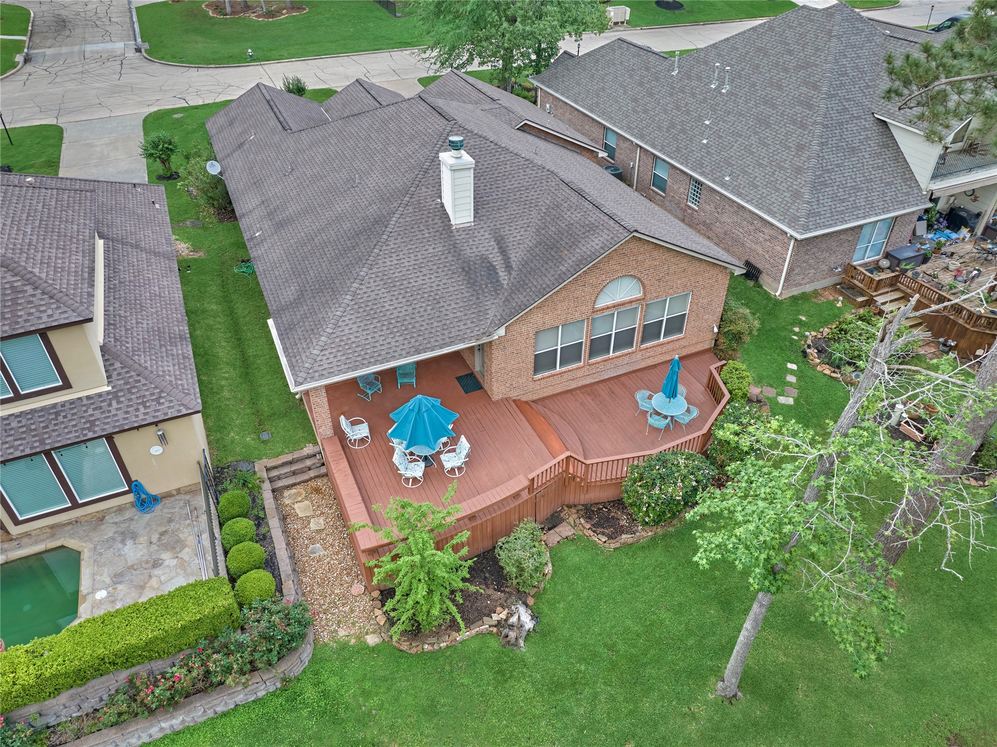 197 Monterrey Road East Montgomery, TX 77356 - Photo 3 of 50 A back patio and expansive deck create the perfect backyard setting for both entertaining and relaxation.