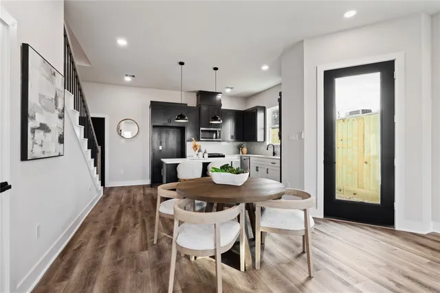 a kitchen with a table and chairs in it