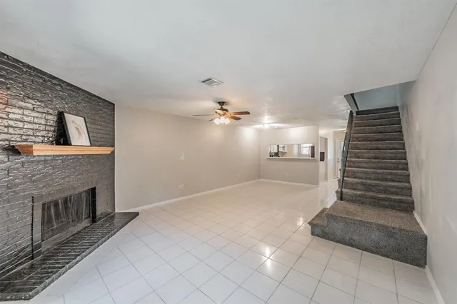 a view of an empty room with stairs