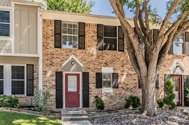 a front view of a house with yard