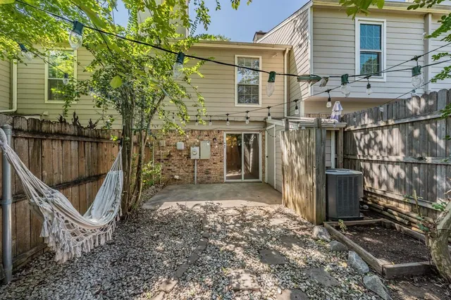 a view of wooden house with a bench