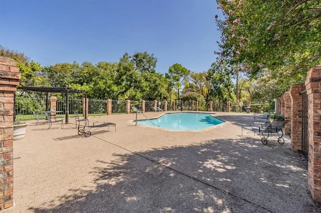 a view of a patio with a table chairs and a table