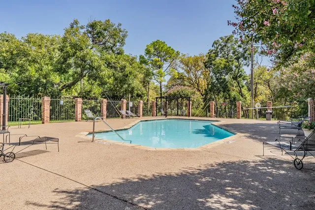 a car parked in front of a white house