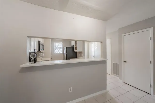 a view of living room with granite countertop furniture and fireplace