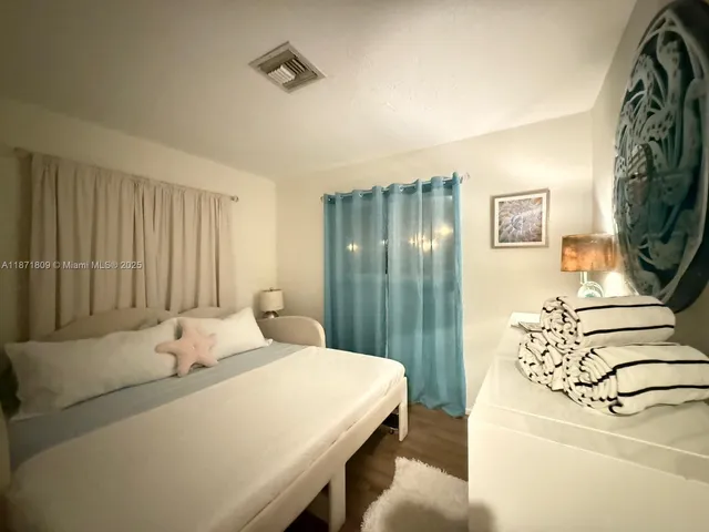 a bedroom with a bed and a cabinets