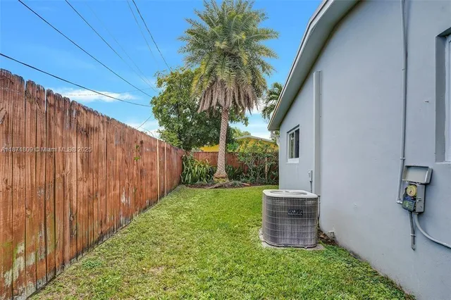 a backyard of a house with seating space