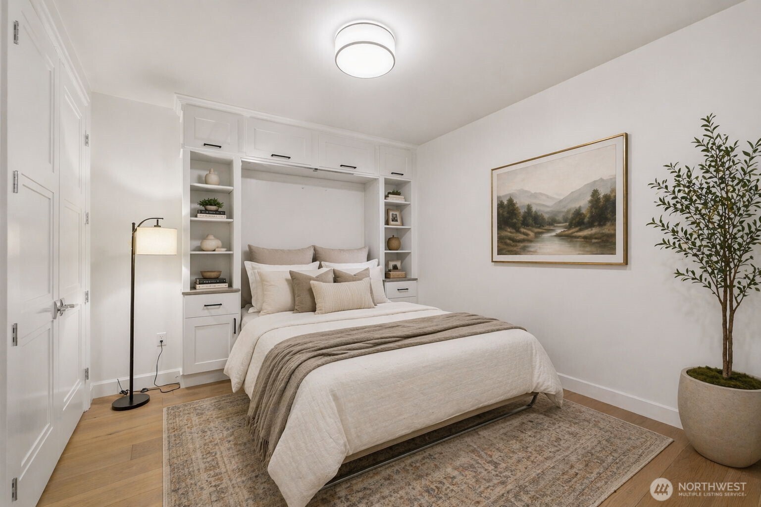 4907 Main Street, Unit 102 Tacoma, WA 98407 - Photo 18 of 34 a bedroom with a bed and a painting on the wall