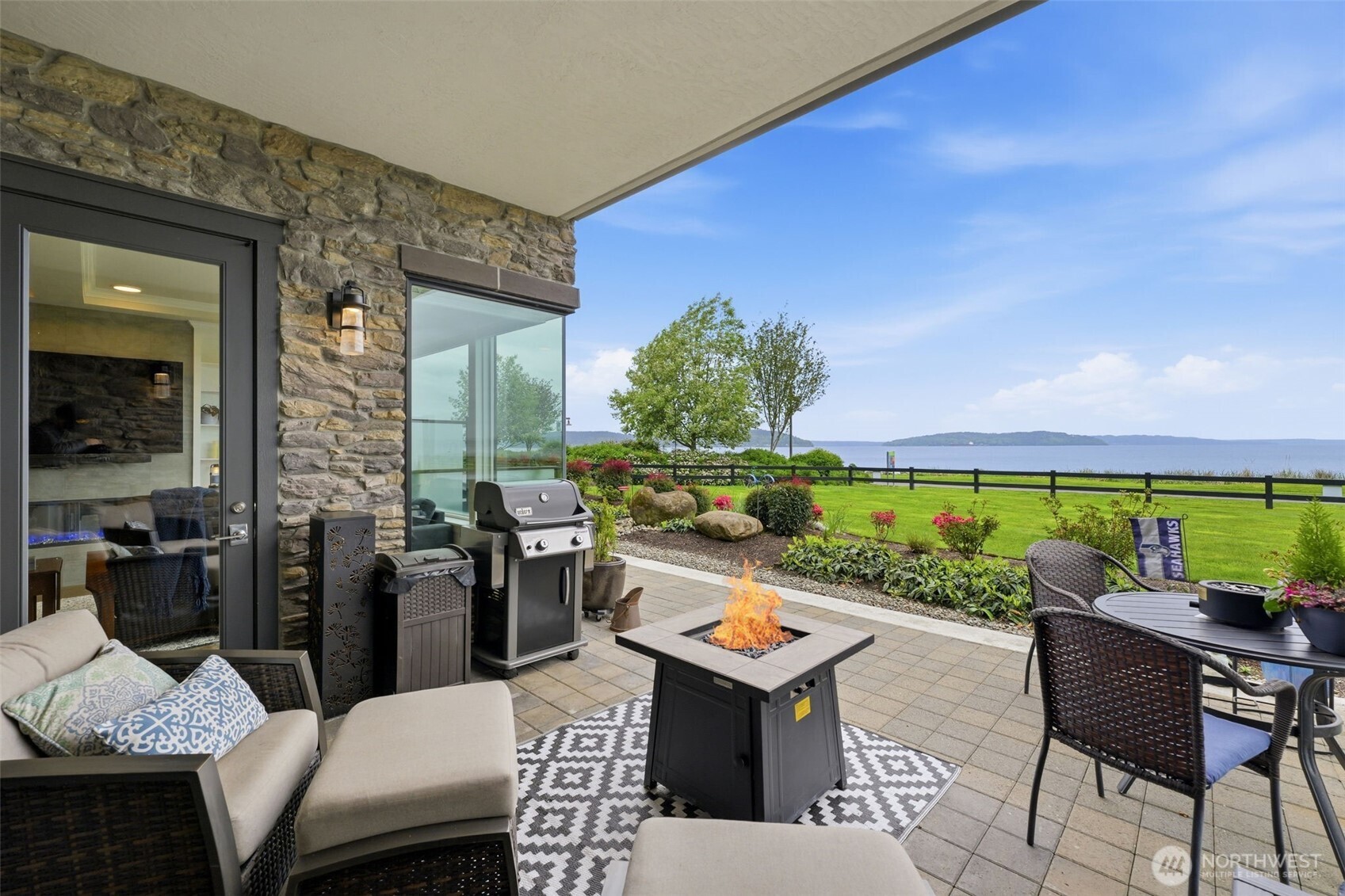4907 Main Street, Unit 102 Tacoma, WA 98407 - Photo 22 of 34 a view of an outdoor dining space with a table and chairs