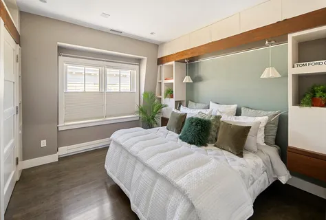 a bedroom with bed and window