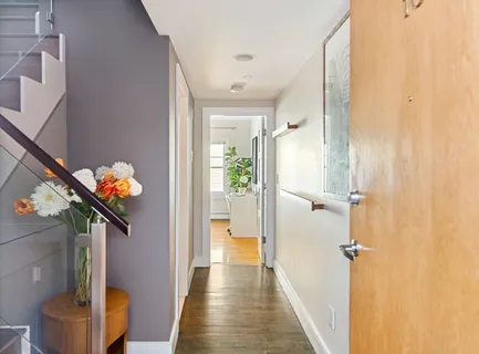 a view of a hallway and a chandelier