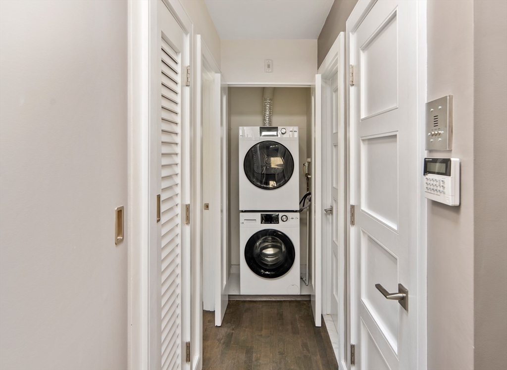 85 Sherman Street, Unit 10 Cambridge, MA 02140 - Photo 18 of 21 a view of a hallway with washer and dryer