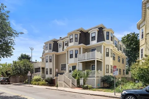 a front view of a building with street view