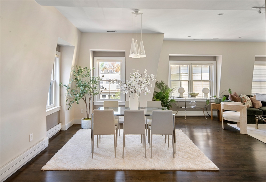 85 Sherman Street, Unit 10 Cambridge, MA 02140 - Photo 5 of 21 a view of a dining room with furniture window and wooden floor