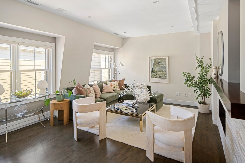 85 Sherman Street, Unit 10 Cambridge, MA 02140 - Photo 7 of 21 a living room with furniture and a potted plant