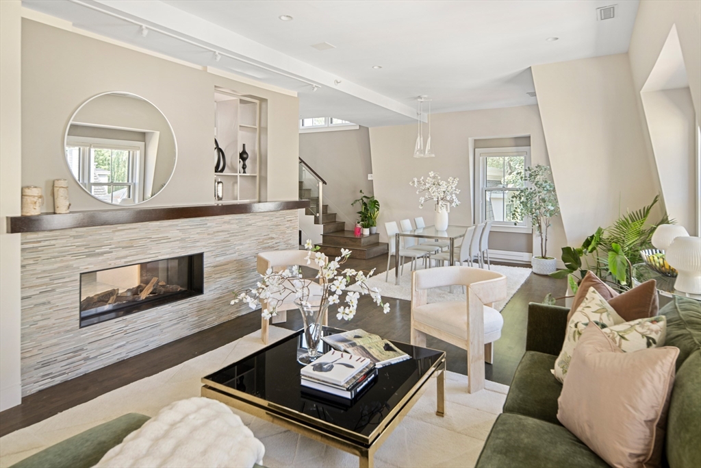 85 Sherman Street, Unit 10 Cambridge, MA 02140 - Photo 8 of 21 a living room with furniture and a fireplace