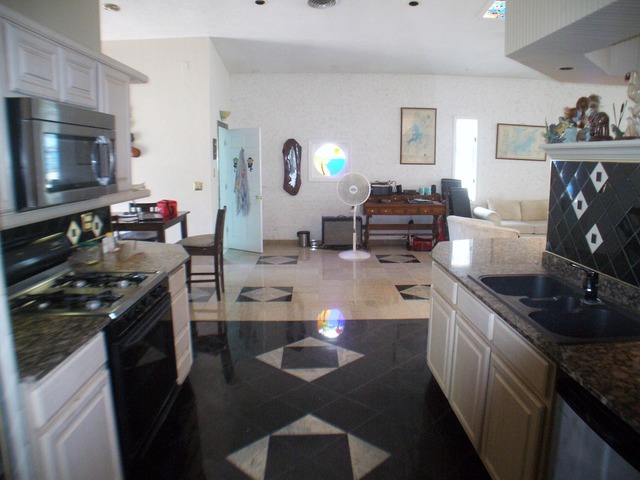 130 Eagle Point Road Fox Lake, IL 60020 - Photo 13 of 25 a kitchen with sink refrigerator and stove