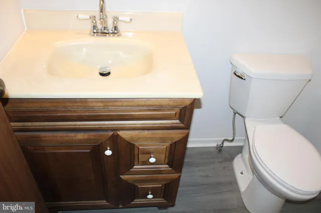 a bathroom with a toilet and a sink