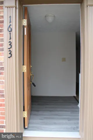 an empty room with wooden floor
