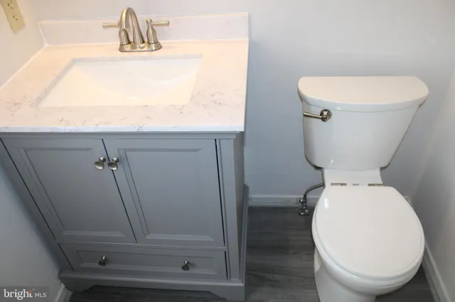 a bathroom with a toilet and a sink