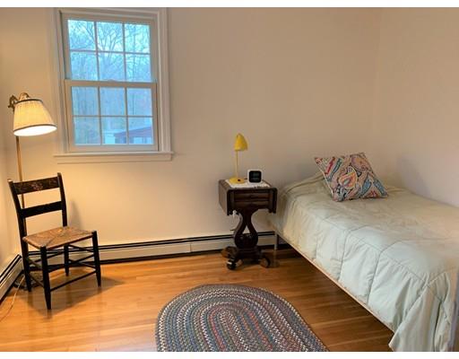32 Tall Tree Road Sharon, MA 02067 - Photo 19 of 29 a bedroom with a bed and wooden floor
