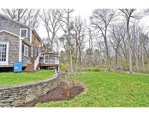 32 Tall Tree Road Sharon, MA 02067 - Photo 28 of 29 a backyard of a house with lots of green space