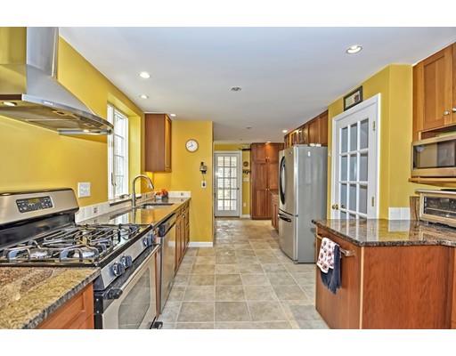 32 Tall Tree Road Sharon, MA 02067 - Photo 3 of 29 a kitchen with stainless steel appliances granite countertop a stove a sink dishwasher and a refrigerator