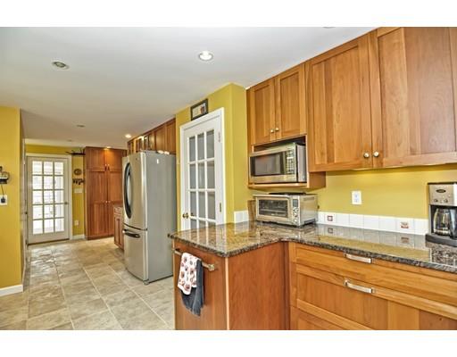 32 Tall Tree Road Sharon, MA 02067 - Photo 5 of 29 a kitchen with stainless steel appliances granite countertop a refrigerator and a sink