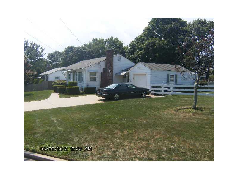 81 Ralston Street Warwick, RI 02888 - Photo 2 of 8 Exterior Front. I am set on a corner with a nice white fence and oh! did I mention my underground sprinkler system?