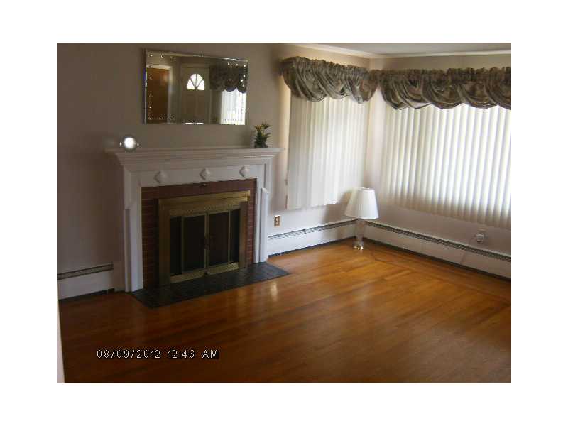 81 Ralston Street Warwick, RI 02888 - Photo 4 of 8 Exterior Front. My gleaming hardwoods are in excellent condition along with my brick fireplace with decorative mantel! Cozy and warm this winter!