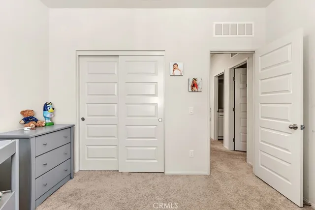 a bathroom with a sink a toilet and shower curtain