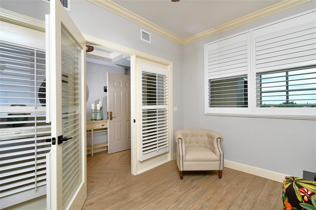 3321 Sunset Key Circle, Unit 408 Punta Gorda, FL 33955 - Photo 13 of 42 a living room with furniture and a window