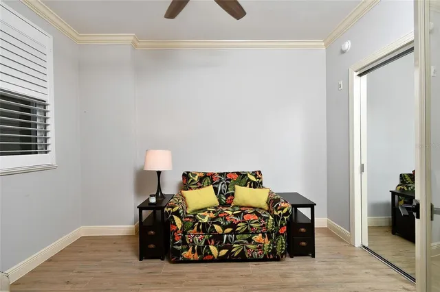 a bed room with furniture and a window