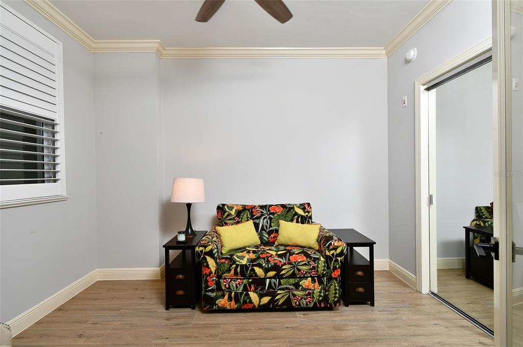 3321 Sunset Key Circle, Unit 408 Punta Gorda, FL 33955 - Photo 14 of 42 a bed room with furniture and a window