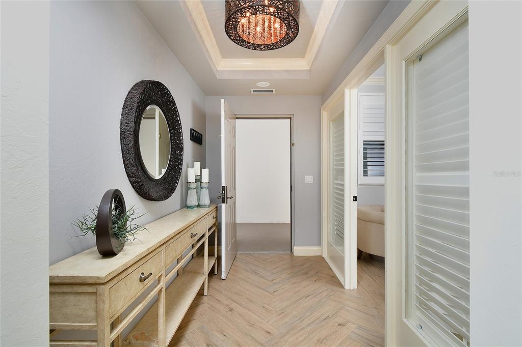 3321 Sunset Key Circle, Unit 408 Punta Gorda, FL 33955 - Photo 15 of 42 a bathroom with a sink a mirror and a shower