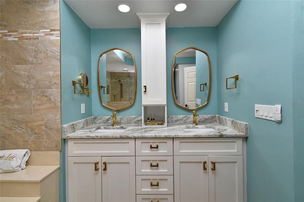 3321 Sunset Key Circle, Unit 408 Punta Gorda, FL 33955 - Photo 26 of 42 a bathroom with a double vanity sink and a mirror
