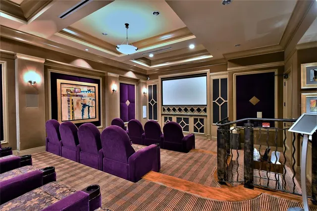 a media room with lots of chairs and a projector