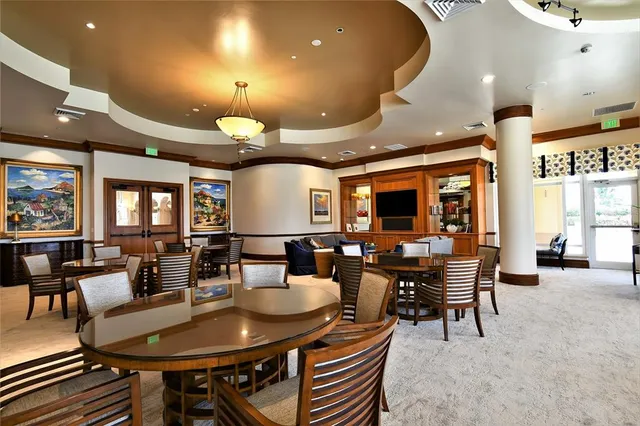 a view of a a dining room with furniture window and outside view