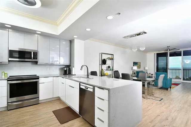 a kitchen with a sink stove and microwave