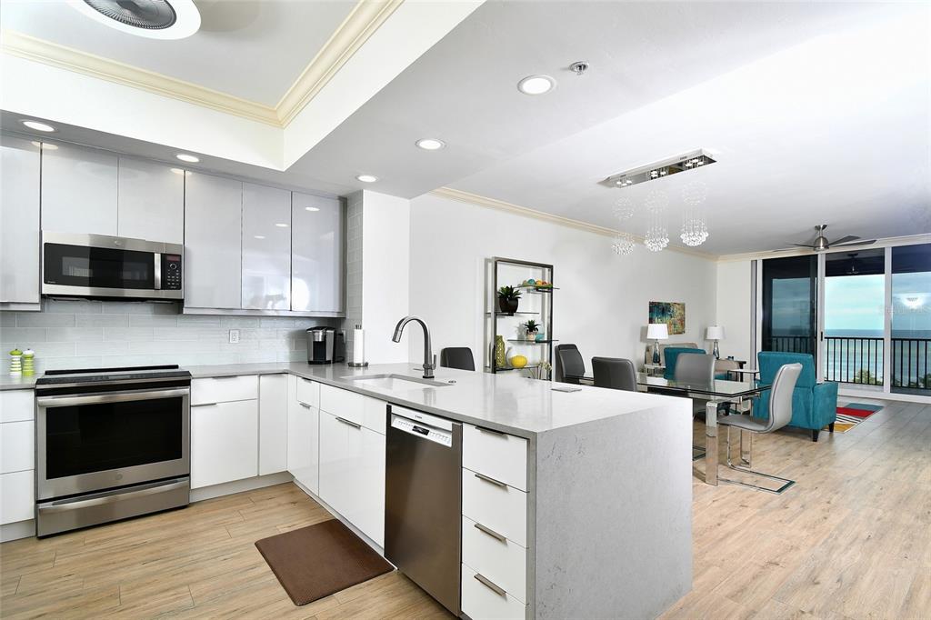 3321 Sunset Key Circle, Unit 408 Punta Gorda, FL 33955 - Photo 9 of 42 a kitchen with a sink stove and microwave