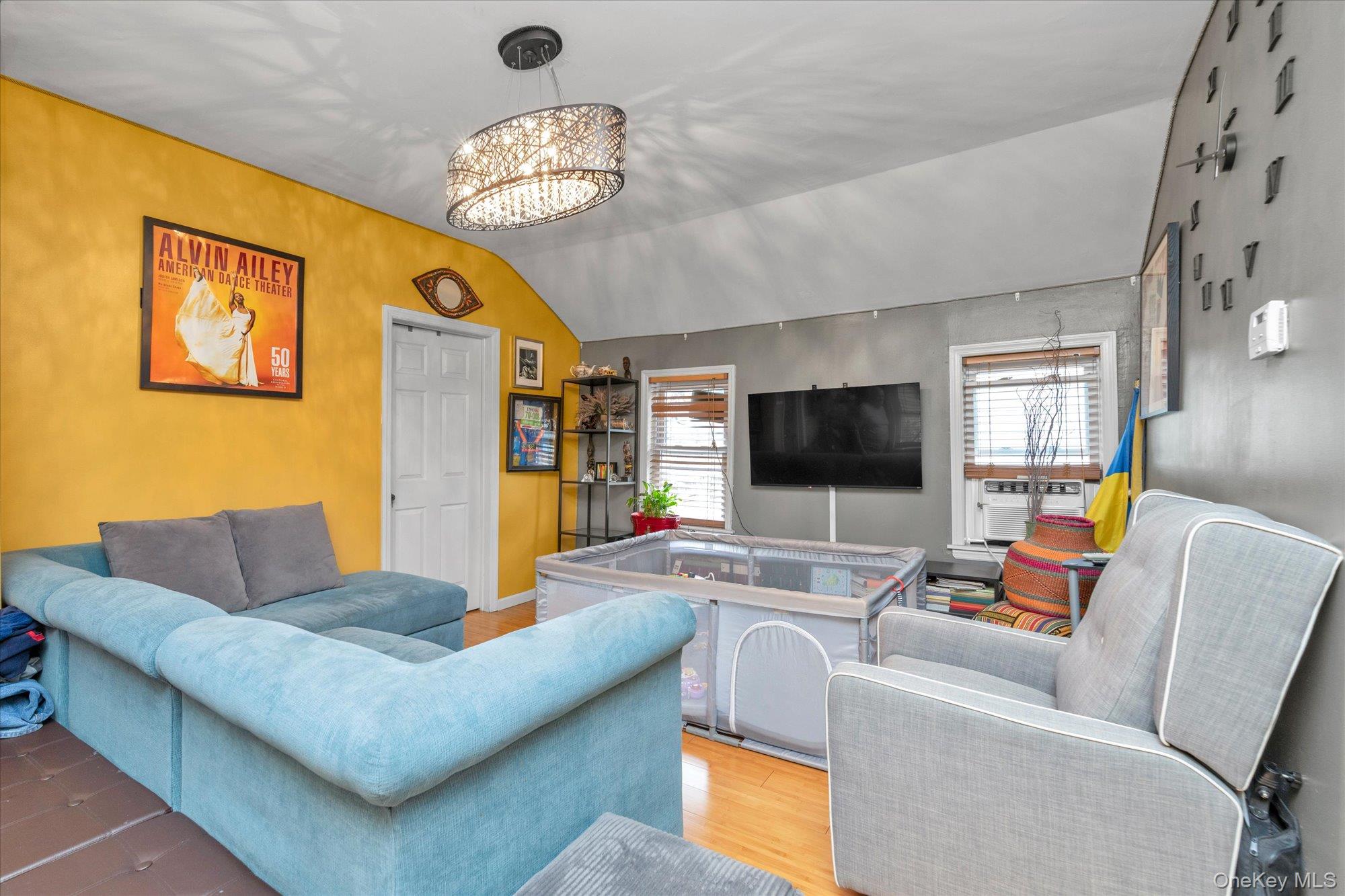 218-12 141st Road Queens, NY 11413 - Photo 12 of 21 a living room with furniture and a flat screen tv
