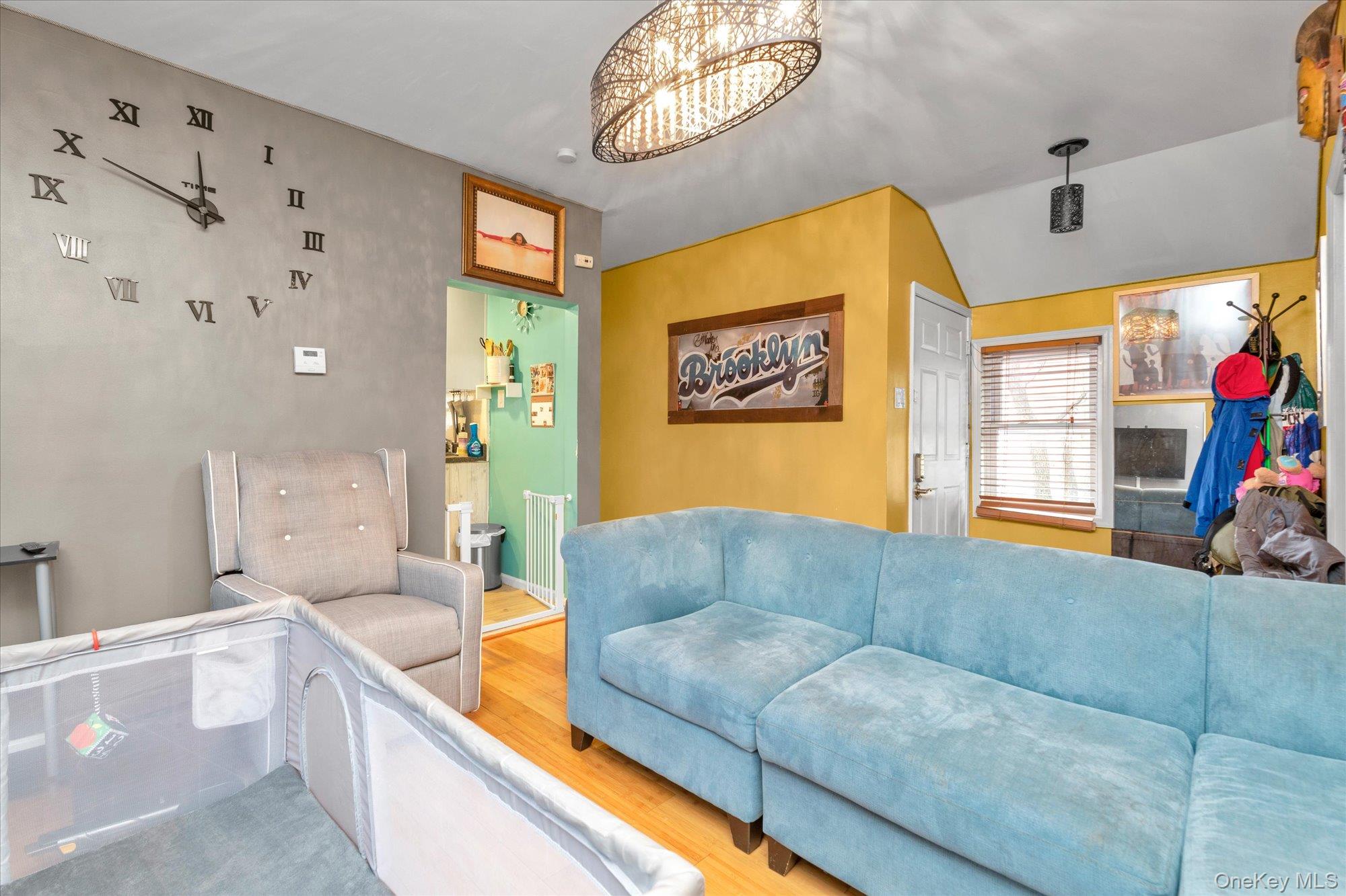 218-12 141st Road Queens, NY 11413 - Photo 14 of 21 a living room with furniture and a flat screen tv