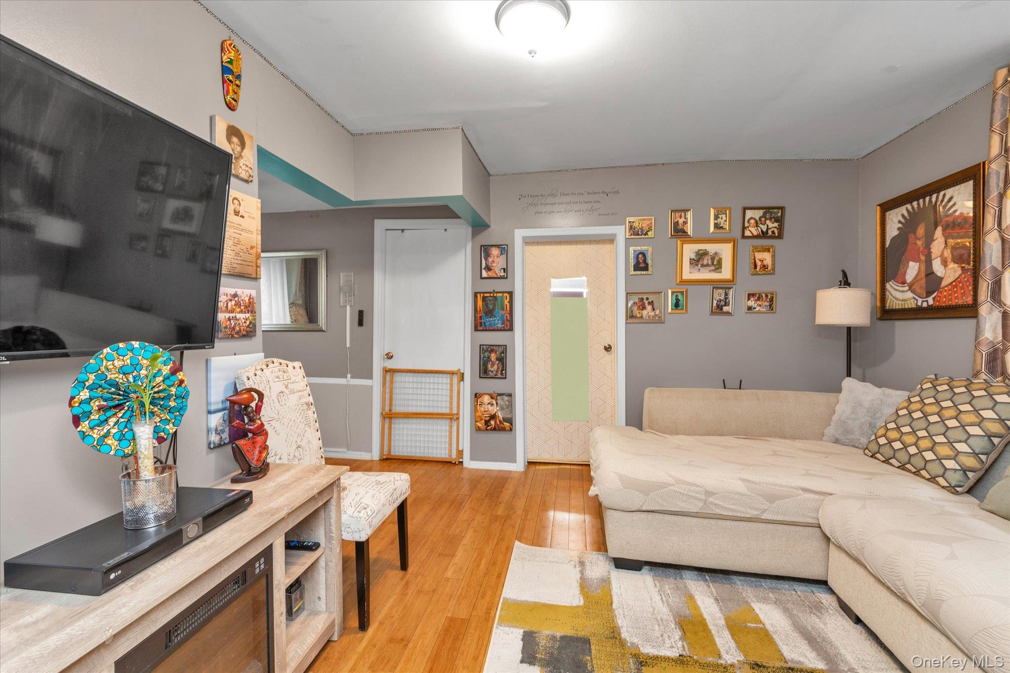 218-12 141st Road Queens, NY 11413 - Photo 2 of 21 a living room with furniture and flowers