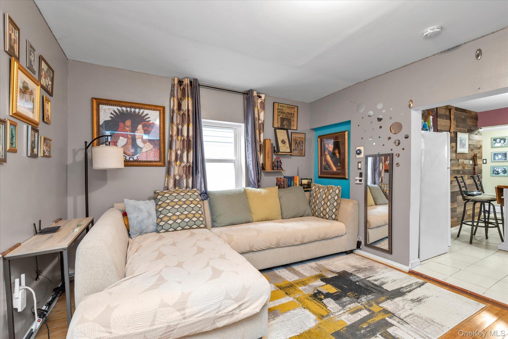 218-12 141st Road Queens, NY 11413 - Photo 3 of 21 a living room with furniture and a couch