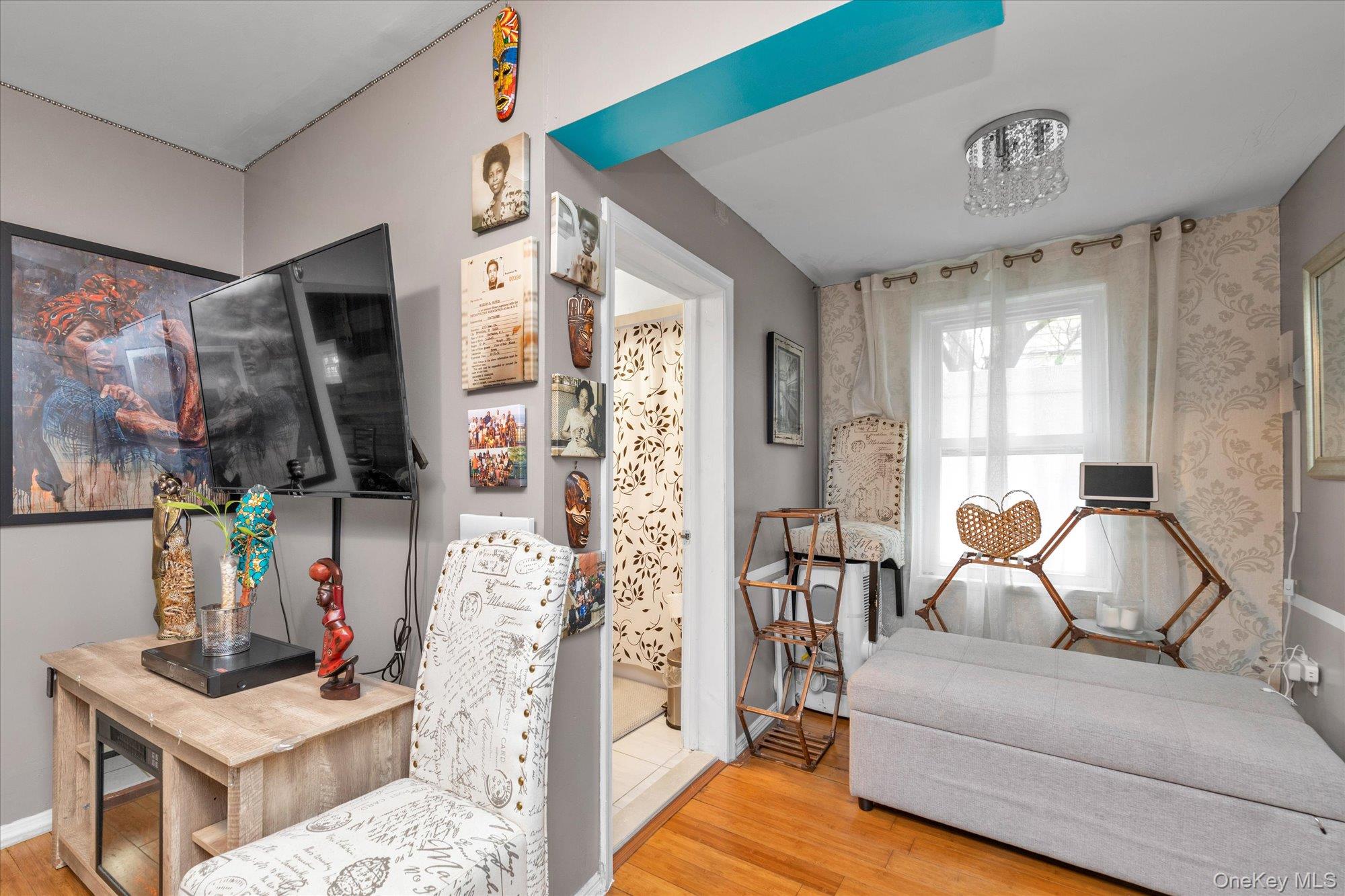 218-12 141st Road Queens, NY 11413 - Photo 4 of 21 a living room with furniture and a flat screen tv