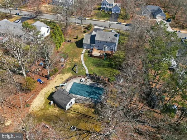 an aerial view of residential houses with outdoor space
